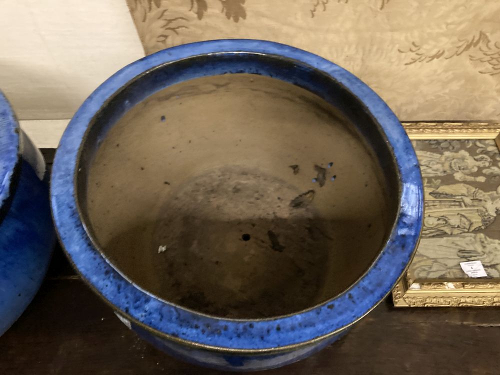 A pair of circular blue glazed garden planters, diameter 52cm, height 30cm